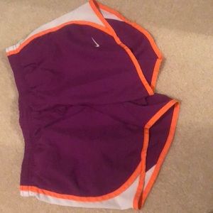 Purple and orange running shorts.